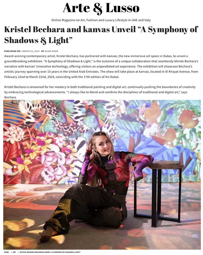 a woman sitting on the floor with a table and a painting on the wall